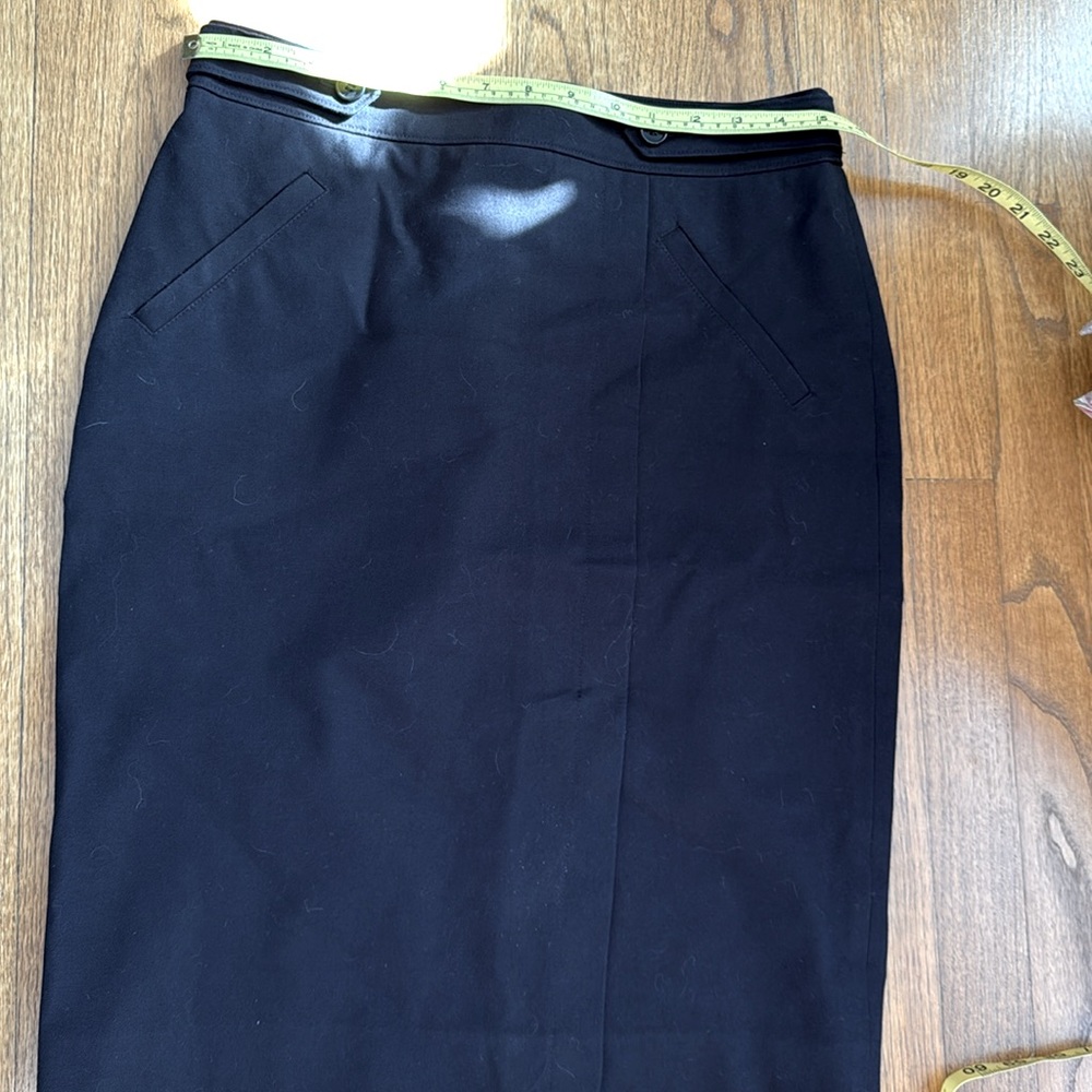 Ann Taylor black size 6 pencil skirt with front slit.